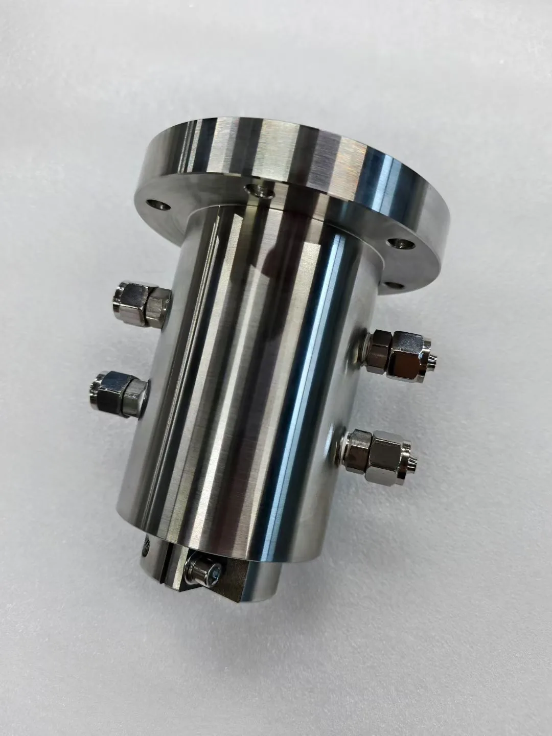 Precision machined stainless steel multi-port cylindrical assembly